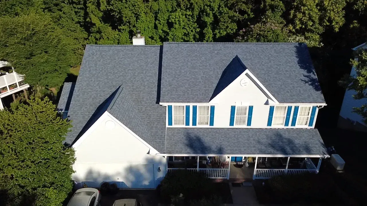 Aerial view of a completed gray shingle roof on a home in the Fredericksburg, VA area
